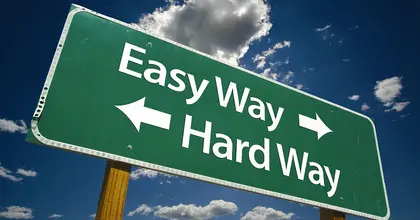 Road sign showing easy and hard way directions
