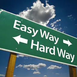 Road sign showing easy and hard way directions
